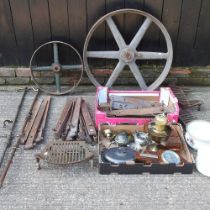 A vintage cast iron cart wheel, 87cm, together with another smaller and a collection of