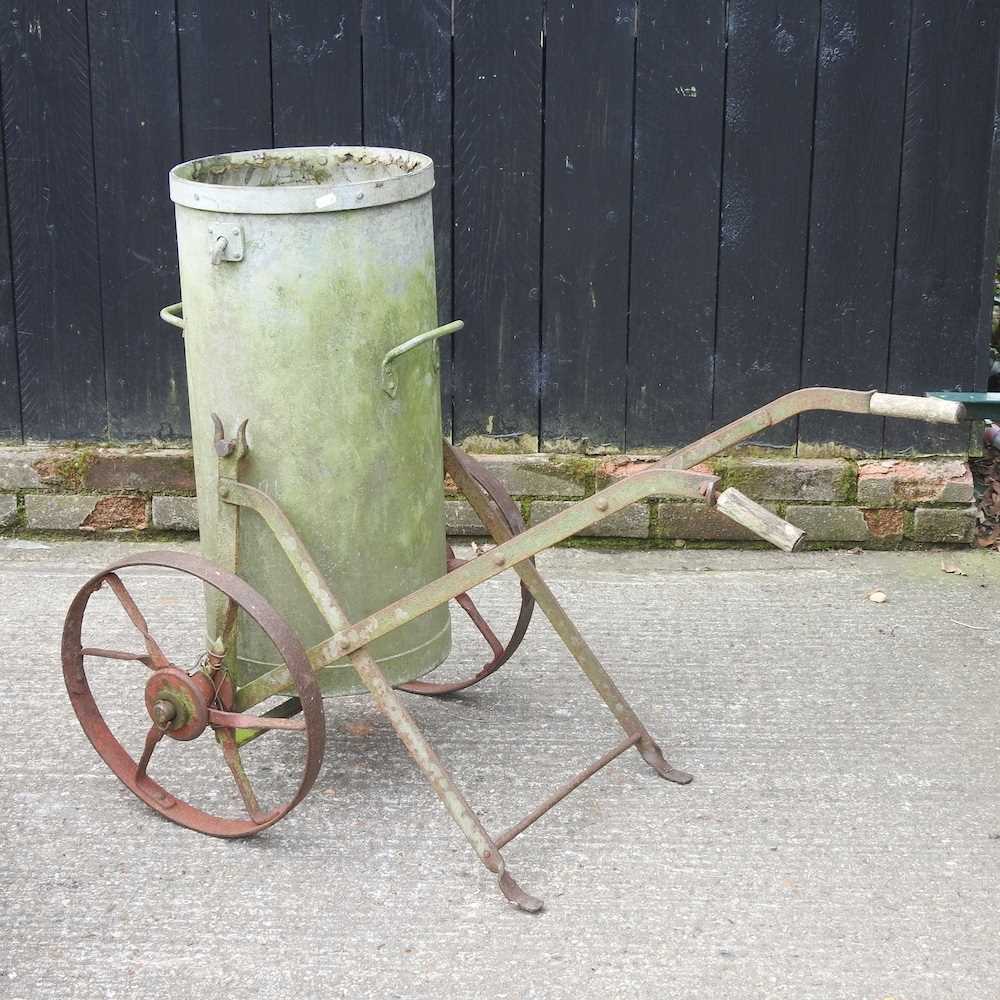 A galvanised water bowser, on a metal stand, 86cm high