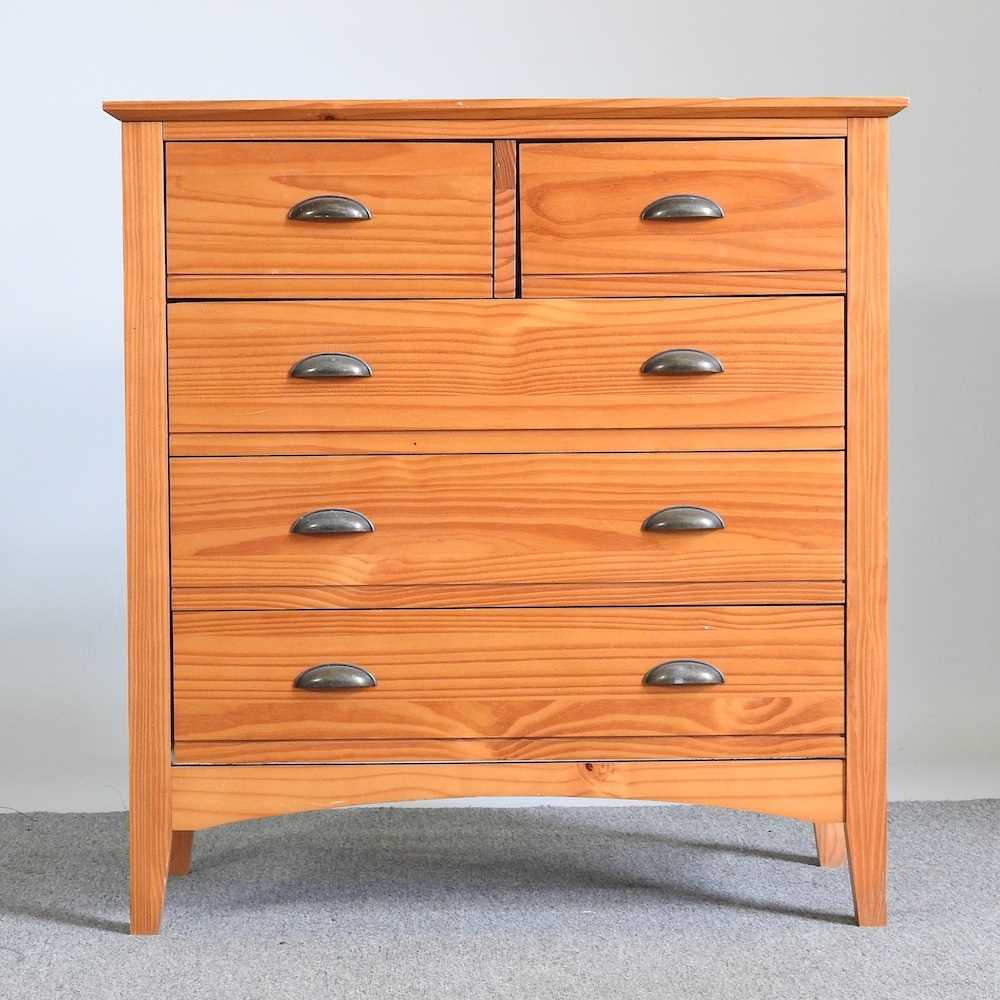 A modern pine chest of drawers, together with a pine dressing mirror (2) 82w x 40d x 86h cm