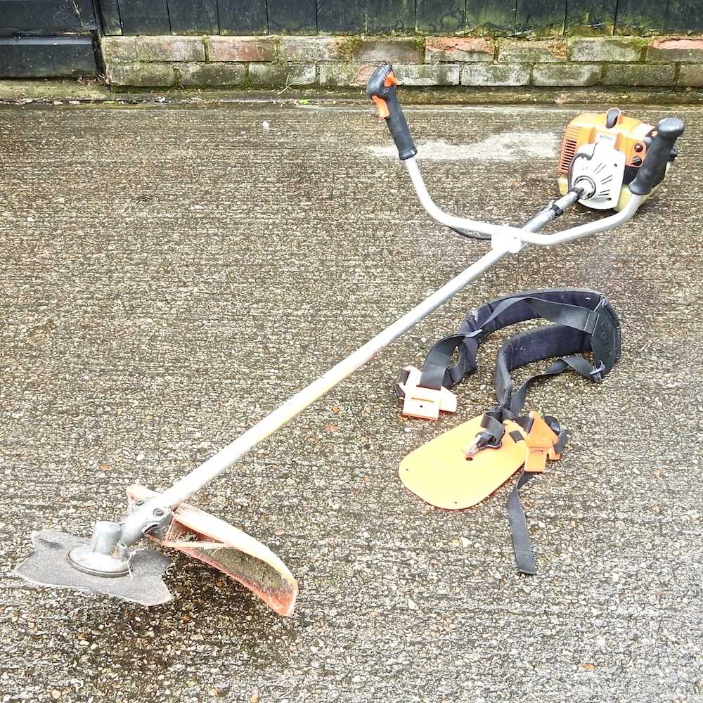 A Stihl petrol brush cutter Overall condition looks to be complete but used. It has compression when