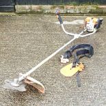 A Stihl petrol brush cutter Overall condition looks to be complete but used. It has compression when