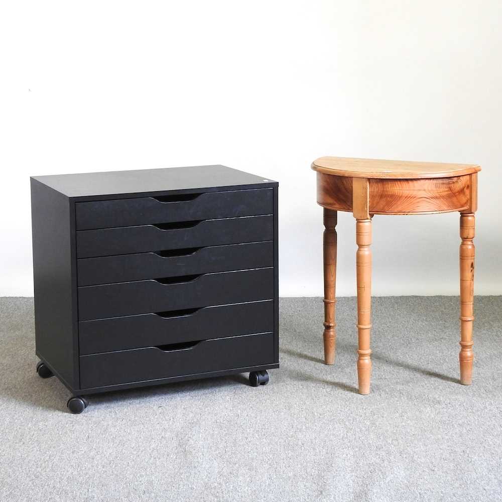 A modern black chest of drawers, 67cm wide, together with a D shaped occasional table (2)