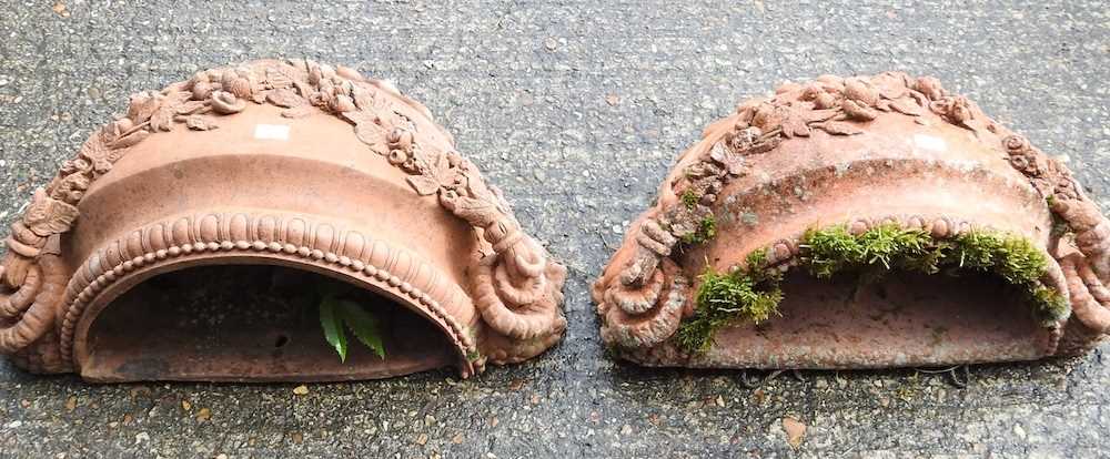 A pair of terracotta stone wall pockets, decorated with festoons of flowers, 42cm wide (2) - Image 2 of 4