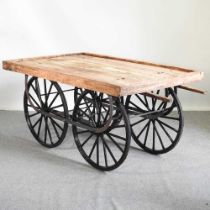A thela wooden hand cart, on a metal base, with spoked wheels 160w x 98w x 79h cm