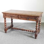 An early 20th century carved oak writing table, on spirally turned supports 120w x 60d x 75h cm
