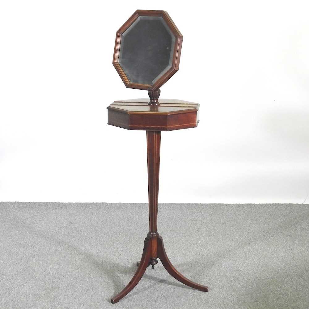 An Edwardian mahogany and inlaid shaving stand, with an adjustable mirror, 134cm high, with a