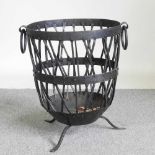 A metal log basket, on a splayed base, 56cm high