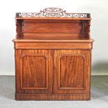 A Victorian mahogany chiffonier, with a fret carved gallery back, on a plinth base 122w x 50d x 138h