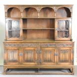 An Old Charm dresser, with linenfold panels 187w x 185h x 49d cm