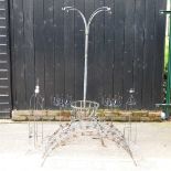 A bird feeder, together with a collection of metal pot stands and supports