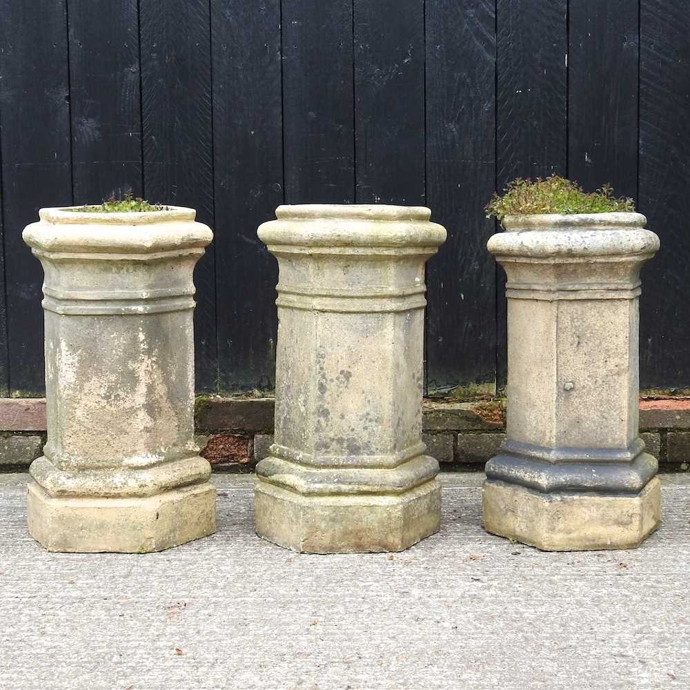 Three terracotta chimney pots, 62cm high (3)