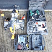 An Evolution chop saw, together with a rotary hammer drill, a cordless drill and a detail sander (