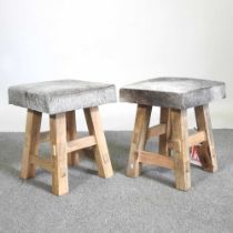 A pair of cowhide upholstered footstools (2)
