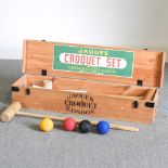A Jaques croquet set, in a wooden box 107w x 27d x 19h cm Overall condition is used, but complete