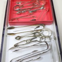 A collection of eight pairs of George III and later silver sugar tongs, various dates and makers,