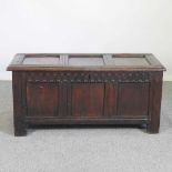 An 18th century panelled oak coffer, of small proportions, with thumb nail decoration 108w x 48d x
