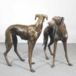 A pair of life sized bronze sculptures of greyhounds, each shown standing, 84cm high (2)
