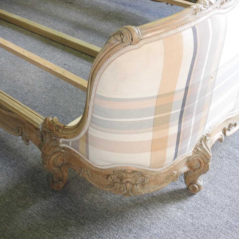 A later 20th century French limed and cream check upholstered double bedstead, with a slatted wooden - Image 4 of 5