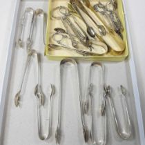 A collection of eight George III and later silver sugar tongs, various dates and makers, 174g gross,