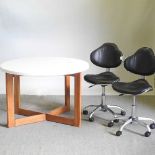 A white painted circular table, together with a pair of office chairs (3)