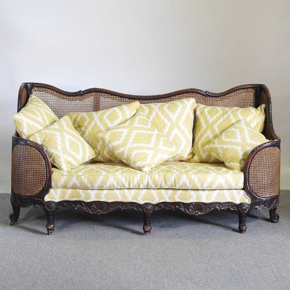 An early 20th century double cane bergere sofa, with yellow upholstery by Merryweather 186w x 72d - Image 3 of 7