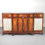 A reproduction mahogany break front sideboard, with grille doors 168w x 42d x 92h cm