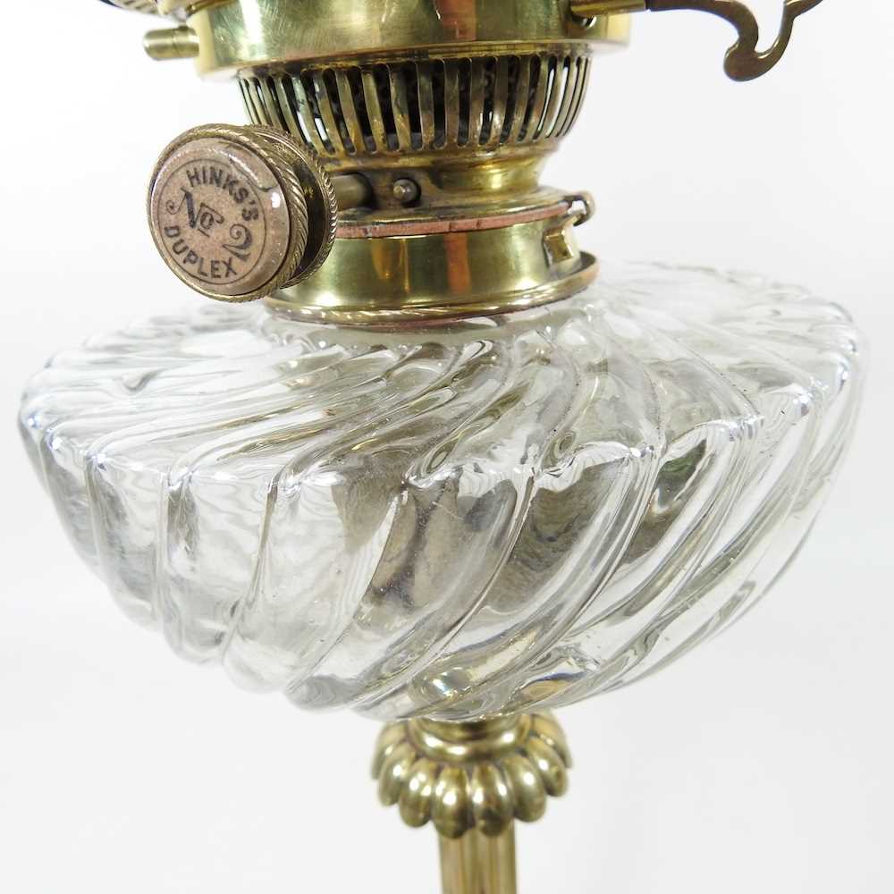 A 19th century brass oil lamp, with a cranberry glass chimney, 65cm high Cranberry chimney is - Image 5 of 6