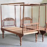 A near pair of Indonesian teak four poster canopy beds, on turned legs (2) 203w x 100d x 188h cm