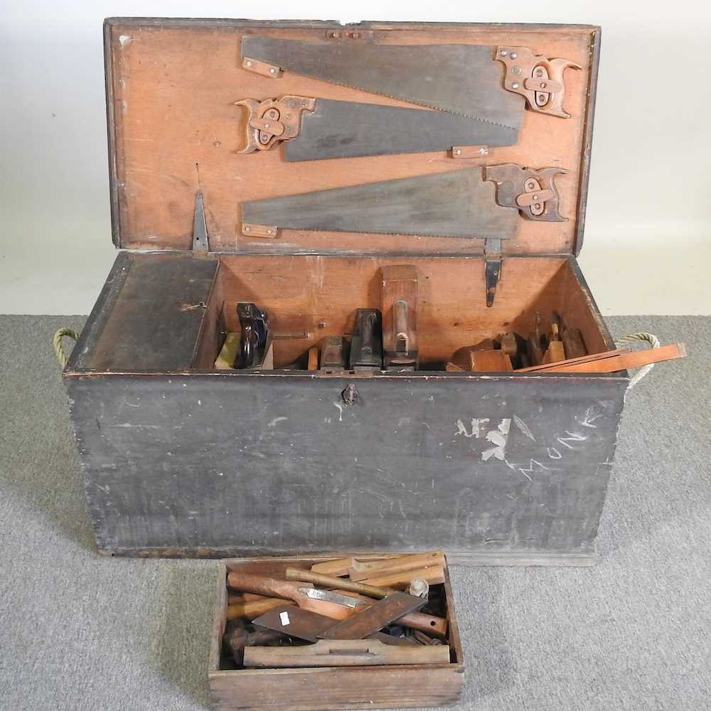A 19th century wooden tool box, 106cm wide, containing a collection of vintage hand tools