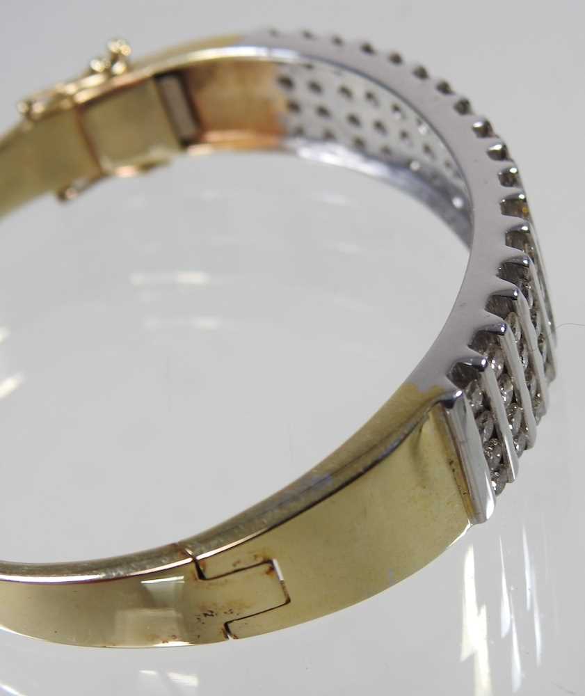 A 14 carat gold and diamond bangle, of hinged design, set with seventeen rows of four diamonds, - Image 5 of 6