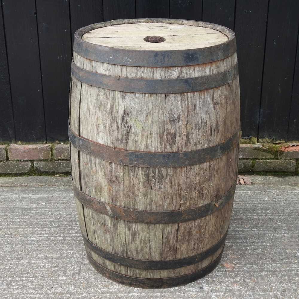 A coopered wooden barrel, 86cm high