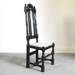 A 17th century style carved ebony and upholstered high back side chair Overall condition is usable