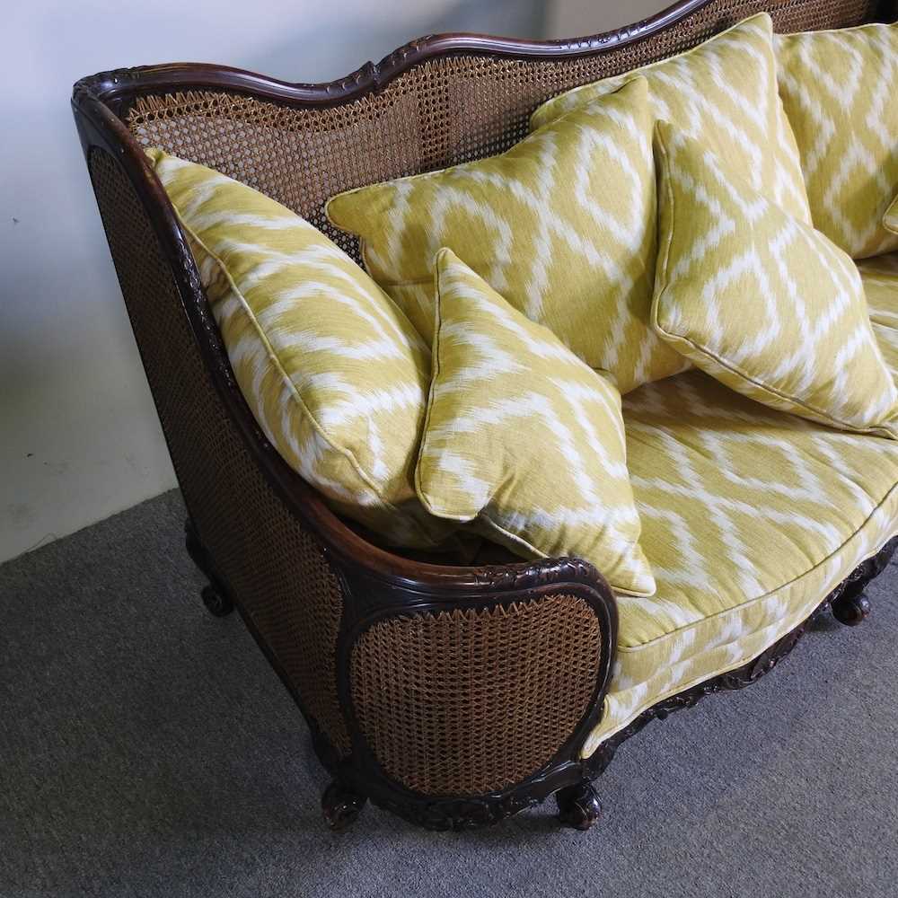 An early 20th century double cane bergere sofa, with yellow upholstery by Merryweather 186w x 72d - Image 4 of 7
