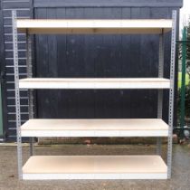 A cream painted metal shelving unit, with four chipboard shelves 185w x 62d x 200h cm