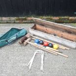 A croquet set, in a wooden box, together with another
