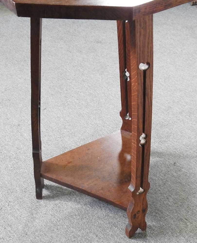 An Art Nouveau oak occasional table, with an octagonal top, on a splayed base 51w x 51d x 75h cm - Image 2 of 4