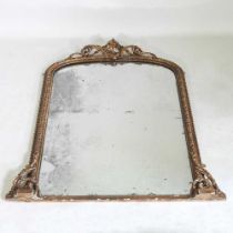A 19th century gilt framed over mantel mirror, of arched shape, within a moulded surround,