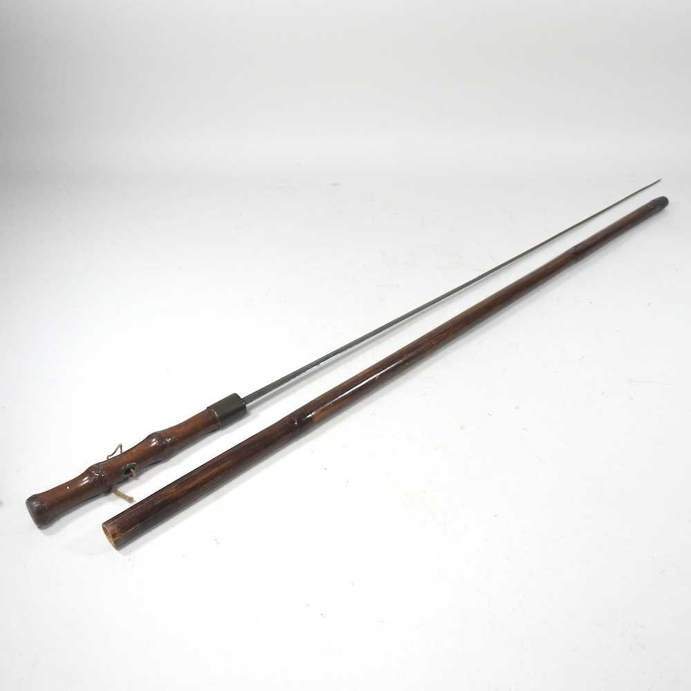 A 19th century bamboo swordstick, 96cm long Overall complete and usable. The bamboo is split. The