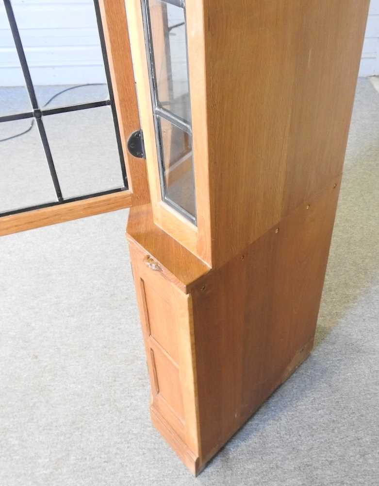 Robert 'Mouseman' Thompson, of Kilburn, a light oak standing corner cabinet, enclosed by a lead - Image 5 of 7