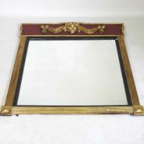 A large Regency style parcel gilt wall mirror, 20th century, the rectangular plate having a reeded