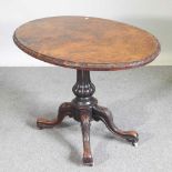 A Victorian burr walnut occasional table, with a hinged oval top, on a splayed base 106w x 73cm
