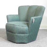 A 1930's green upholstered armchair