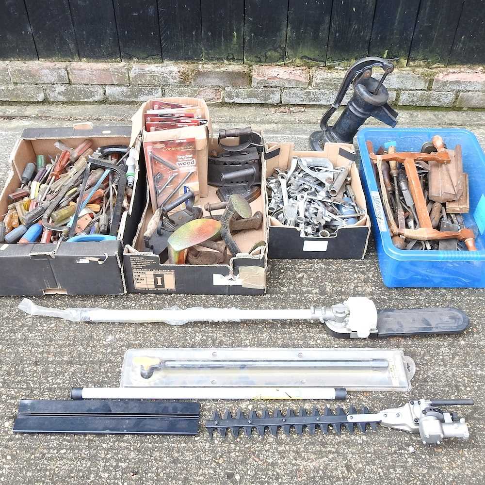 A collection of various tools, together with a garden pump