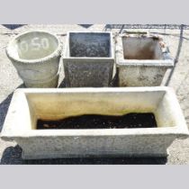 A cast stone garden trough, 97cm wide with three various garden pots (4)