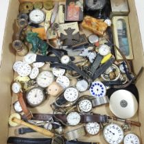 A collection of pocket watch parts, wristwatches and other items
