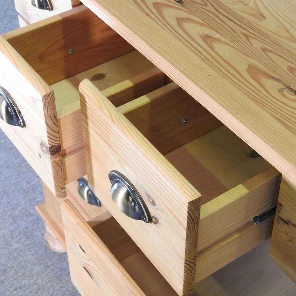 A pine merchant's chest, containing an arrangement of sixteen short drawers 132w x 40d x 82h cm - Image 2 of 5