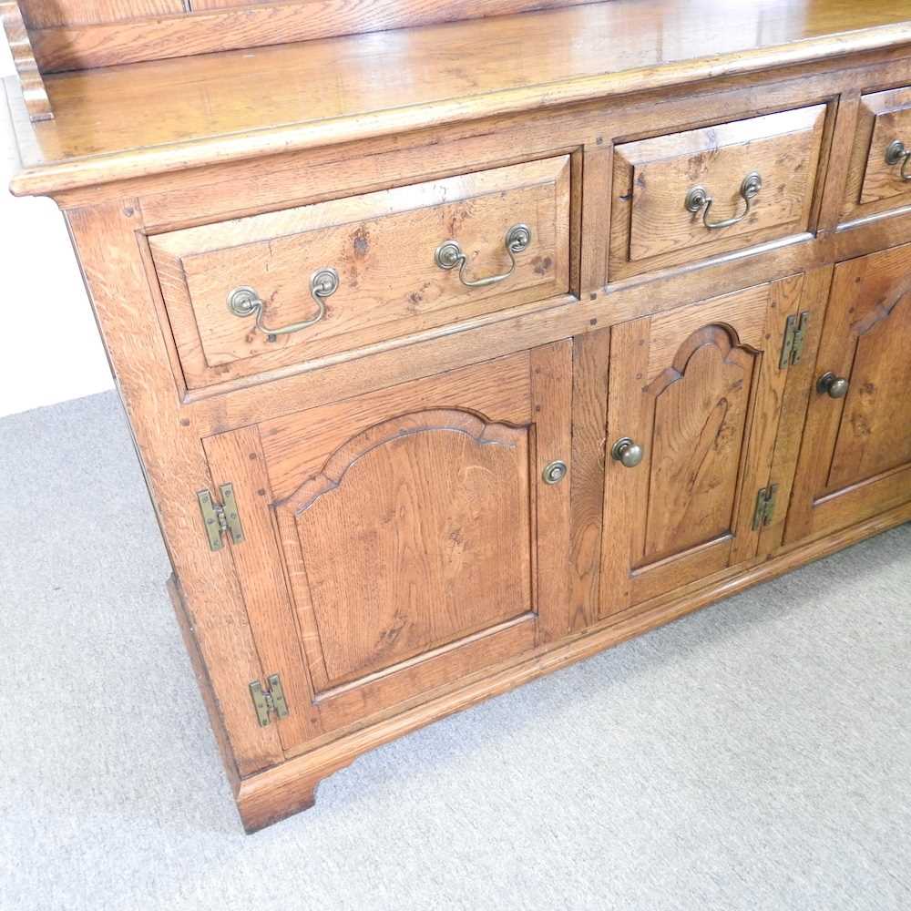 An 18th century style oak dresser, with a boarded back, on bracket feet 143w x 216h x 51d cm - Bild 4 aus 9