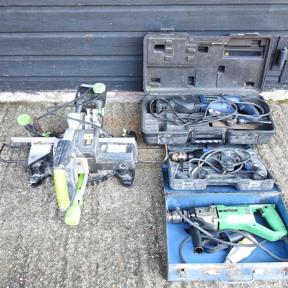 An Evolution chop saw, together with a power saw, a drill and another (4)