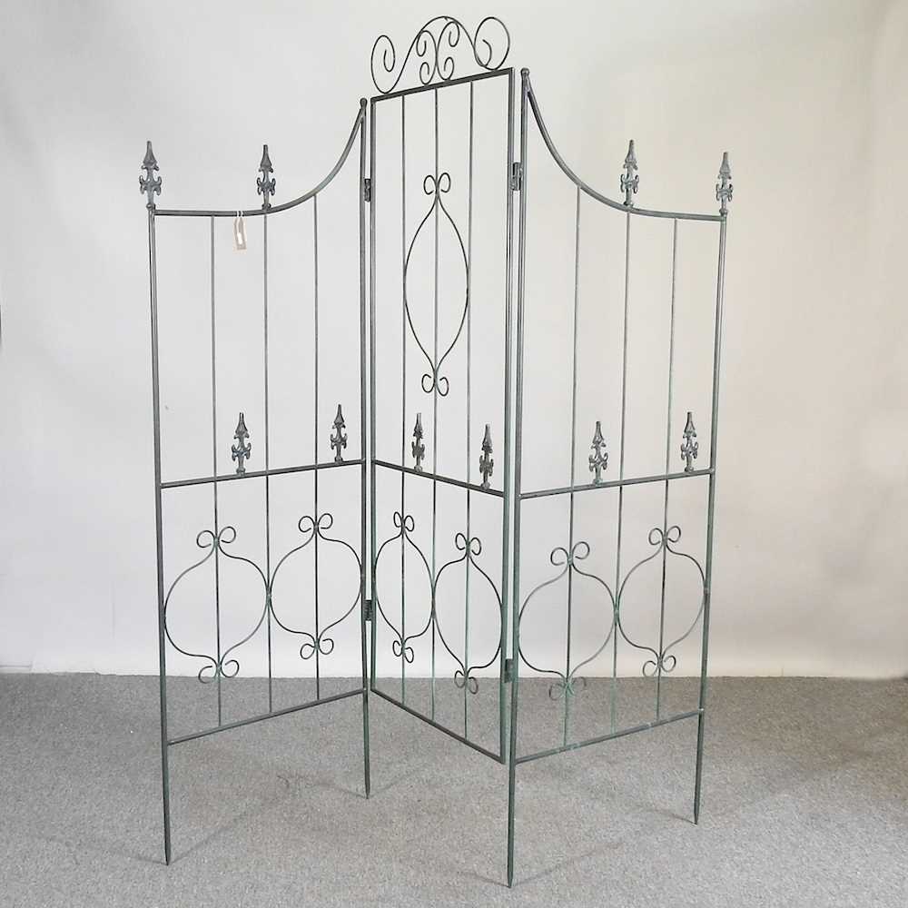 A metal folding garden screen, with three panels 182w x 184h cm