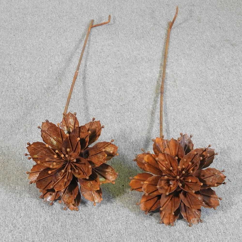 A rusted flower head plant support, together with another, 141cm high (2)